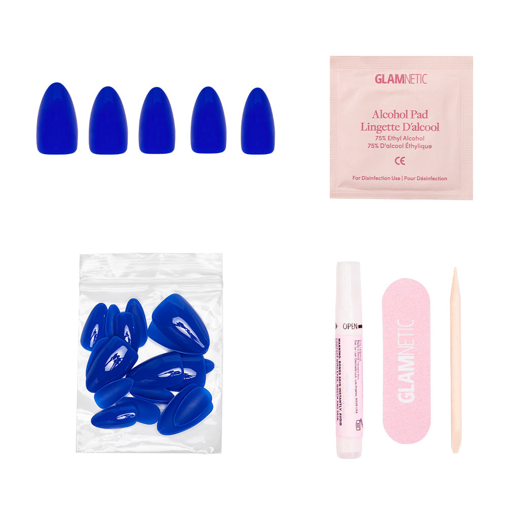 Set of blue false nails with packaging and tools on a white background